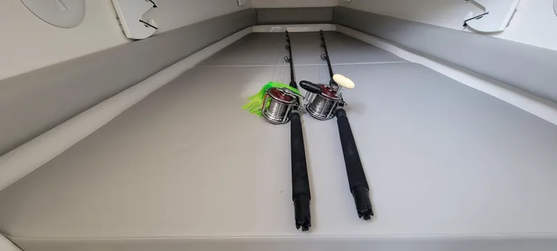 Slide: The Image of 2023 Regulator 34 boat interior with fishing rods on deck. - 21