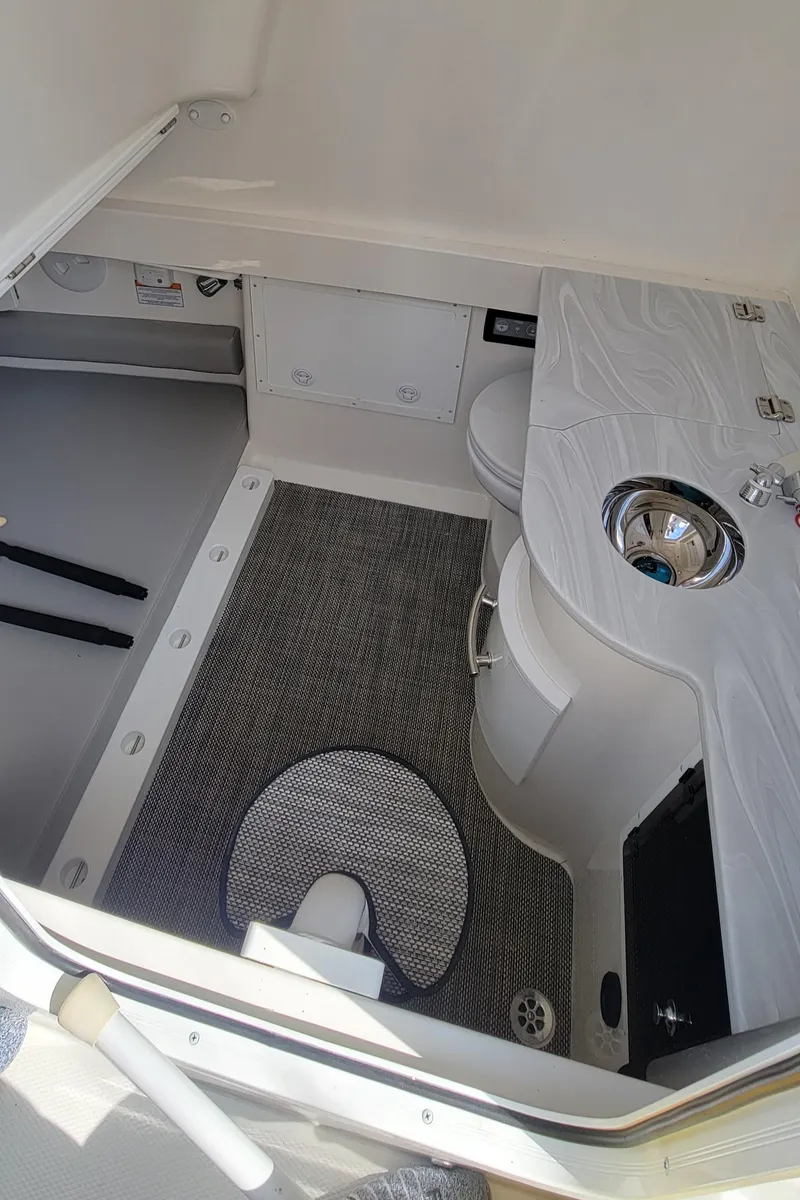Slide: The Image of 2023 Regulator 34 boat interior with sink and storage area. - 24