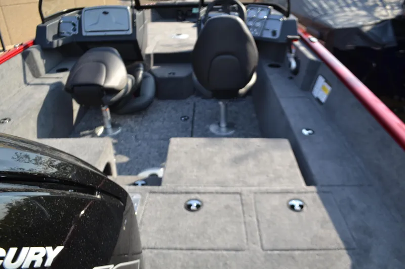 Slide: The Image of 2025 Tracker Pro Guide V-175 Combo boat interior with seating and Mercury engine. - 2