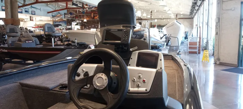 Slide: The Image of 2025 Tracker Pro Team 175 boat interior with steering wheel and control panel. - 2