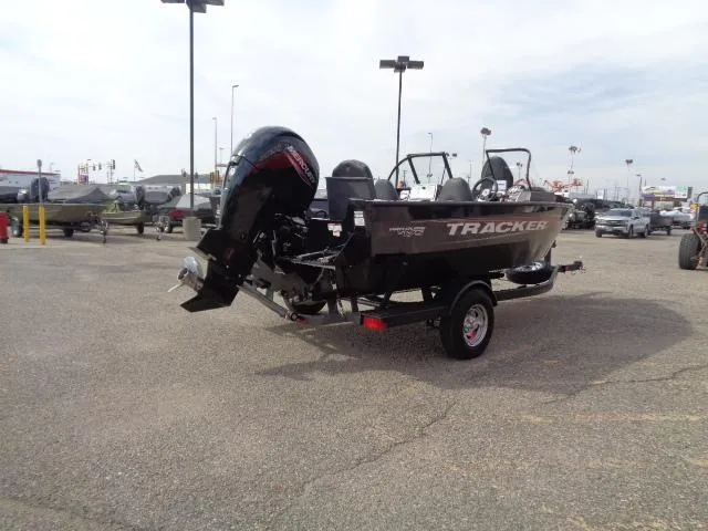 Slide: The Image of 2025 Tracker Pro Guide V-175 Combo boat in parking lot, rear view. - 2