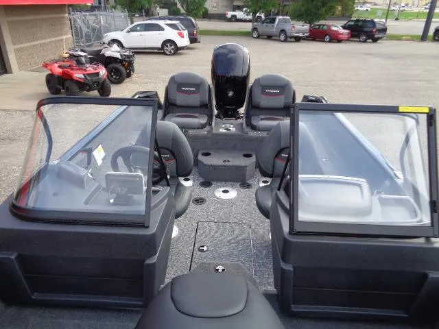 Slide: The Image of 2025 Tracker Pro Guide V-175 Combo boat interior with seating and controls. - 8