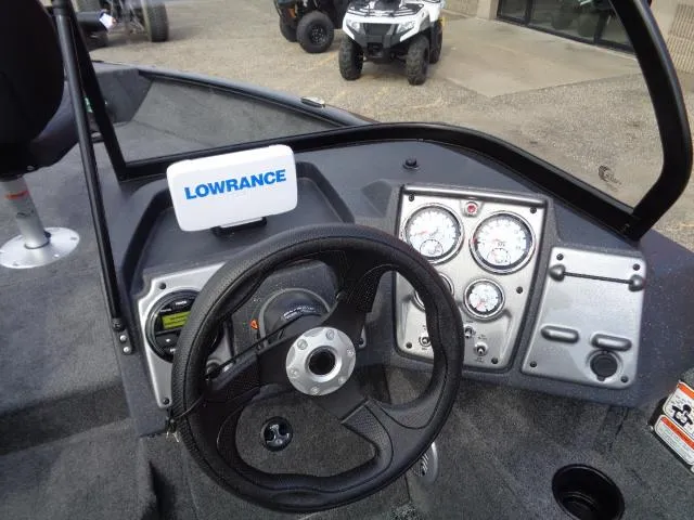 Slide: The Image of 2025 Tracker Pro Guide V-175 Combo dashboard with Lowrance display and gauges. - 9