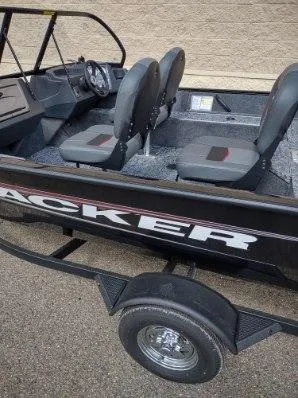 Slide: The Image of 2025 Tracker Pro Guide V-16 WT boat interior with seating and steering wheel. - 3