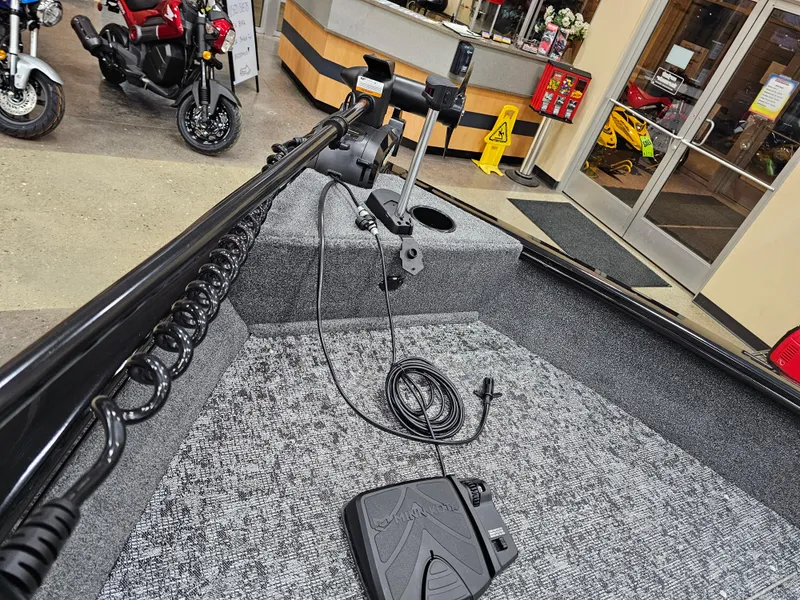 Slide: The Image of 2025 Tracker Pro Guide V-16 SC boat interior with trolling motor and foot pedal. - 10