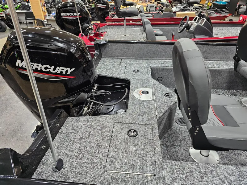 Slide: The Image of 2025 Tracker Pro Guide V-16 SC boat interior with Mercury engine and seating. - 11
