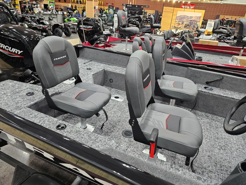 Slide: The Image of 2025 Tracker Pro Guide V-16 SC boat with gray seating and spacious interior. - 12