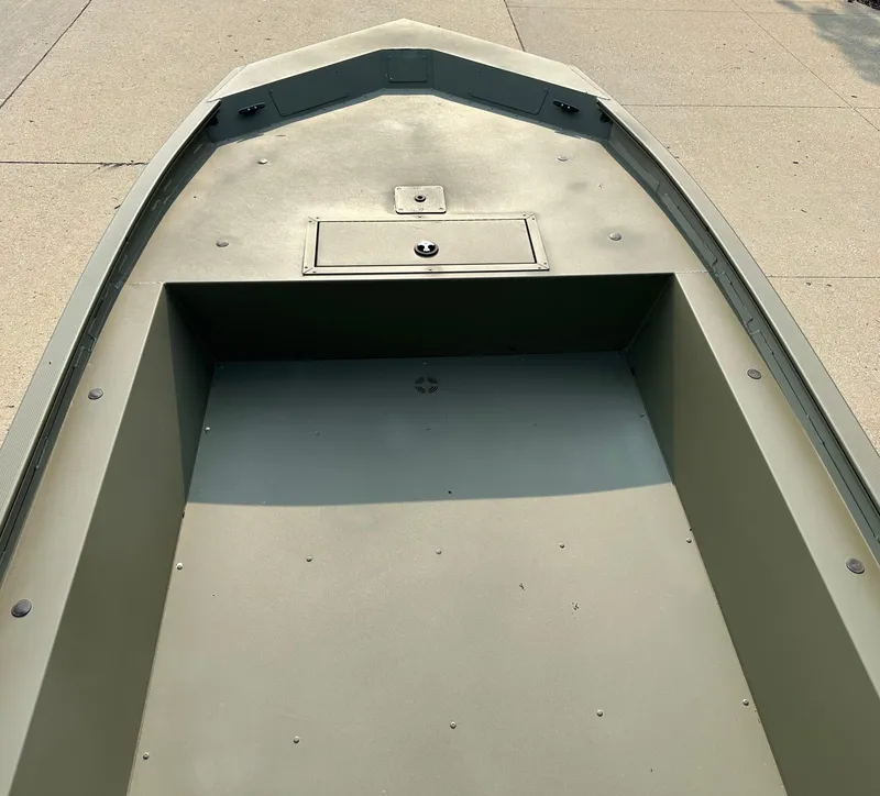 Slide: The Image of 2025 Tracker Grizzly 1754 Jon boat interior, showing spacious, durable deck design. - 2