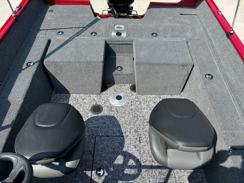 Slide: The Image of 2025 Tracker Pro Guide V-175 Combo boat interior with two seats and carpeted flooring. - 6