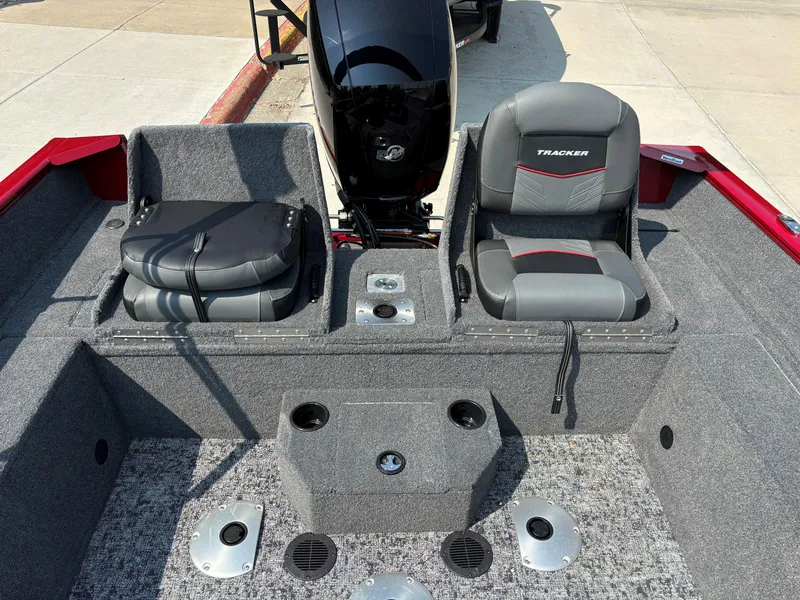 Slide: The Image of 2025 Tracker Pro Guide V-175 Combo boat interior with seating and motor. - 7