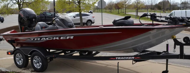 The Image of 2025 Tracker Pro Team 195 Tournament Edition boat on trailer, parked outdoors. - 0