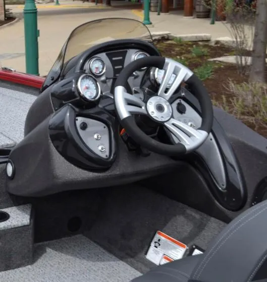Slide: The Image of 2025 Tracker Pro Team 195 Tournament Edition boat dashboard with modern steering and gauges. - 2