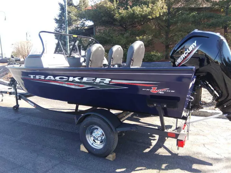 Slide: The Image of 2025 Tracker Pro Guide V-175 Combo boat with Mercury engine on trailer. - 2