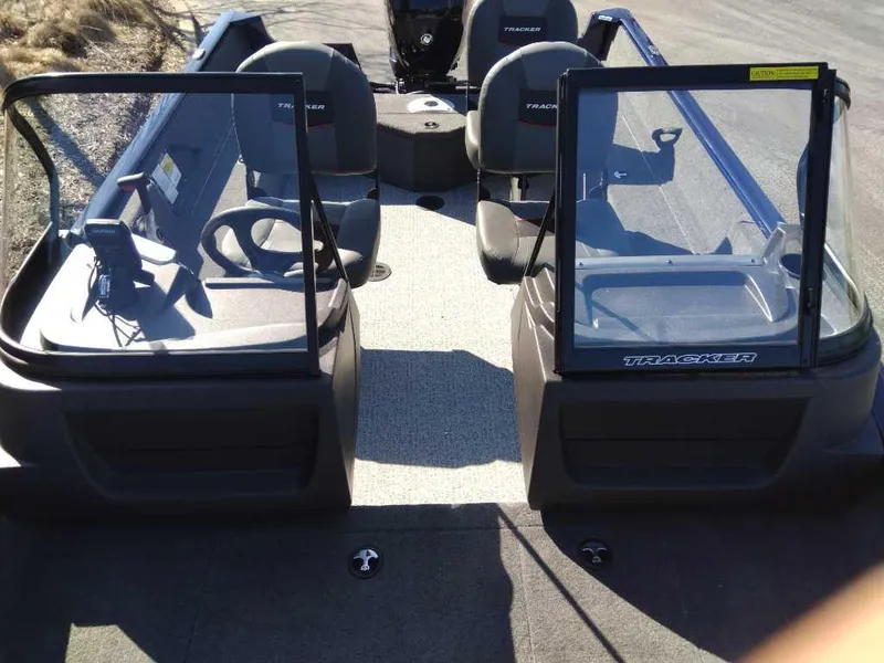 Slide: The Image of 2025 Tracker Pro Guide V-175 Combo boat interior with seating and steering console. - 4