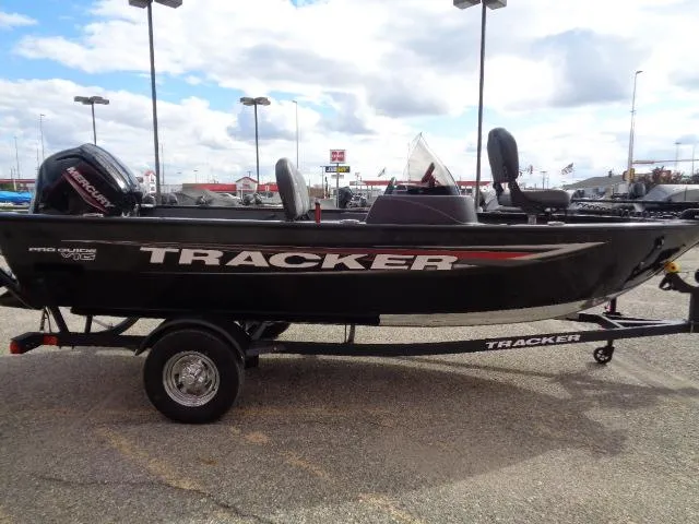 Slide: The Image of 2025 Tracker Pro Guide V-16 SC boat on trailer, outdoor display. - 3