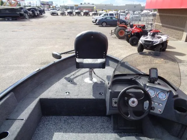 Slide: The Image of 2025 Tracker Pro Guide V-16 SC boat interior with steering wheel and seat. - 7