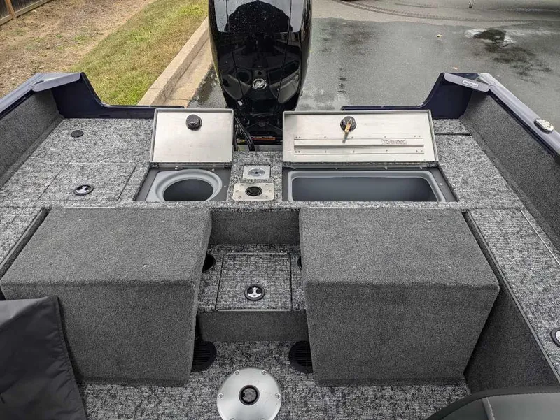 Slide: The Image of 2025 Tracker Pro Guide V-175 Combo boat interior with storage compartments and seating. - 3