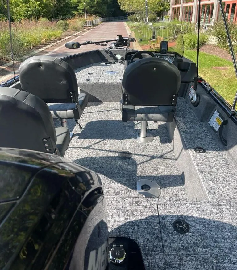Slide: The Image of 2025 Tracker Pro Guide V-16 SC boat interior with seating and controls. - 3