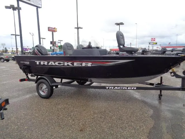Slide: The Image of 2025 Tracker Pro Guide V-16 SC boat on trailer in parking lot. - 4