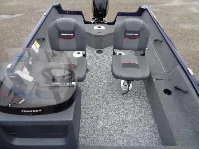 Slide: The Image of 2025 Tracker Pro Guide V-16 SC boat interior with two seats and console. - 8