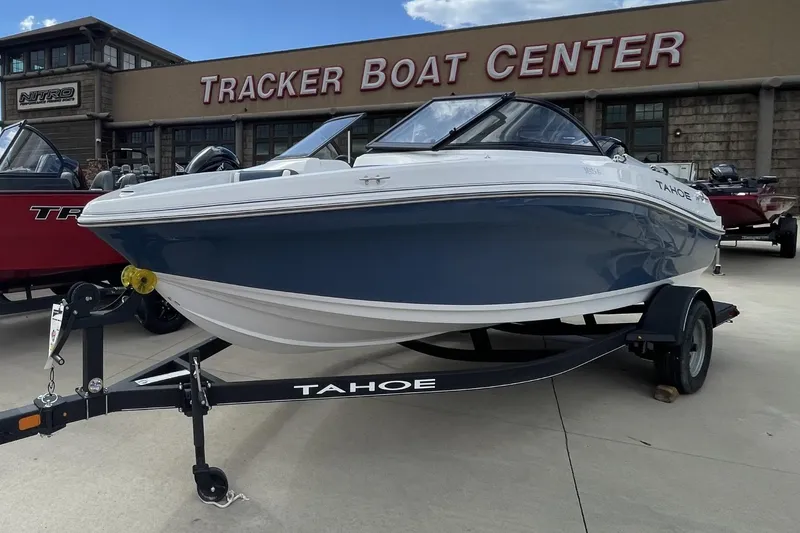Slide: The Image of 2024 Tahoe 185 S boat displayed at Tracker Boat Center dealership. - 5