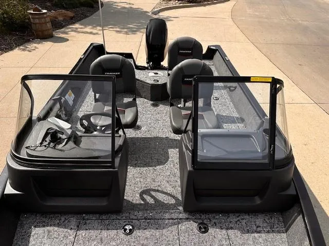 Slide: The Image of 2025 Tracker Pro Guide V-16 WT boat interior with seating and console. - 7