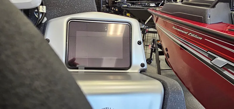 Slide: The Image of 2025 Tracker Pro Team 195 Tournament Edition boat with control panel and red exterior. - 10