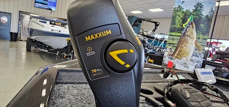 Slide: The Image of 2025 Tracker Pro Team 195 Tournament Edition boat with Maxxum trolling motor in showroom. - 16