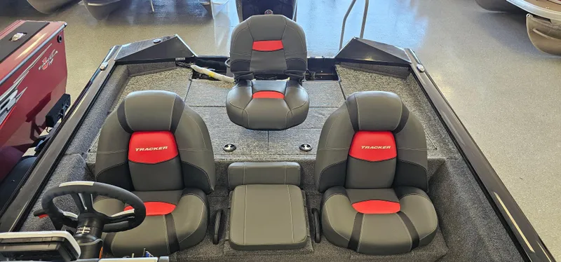 Slide: The Image of 2025 Tracker Pro Team 195 Tournament Edition boat interior with three black and red seats. - 3