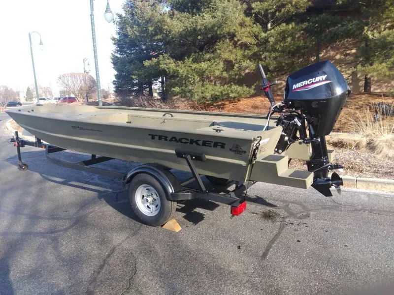 Slide: The Image of 2025 Tracker Grizzly 1654 T Sportsman boat with Mercury engine on trailer. - 3