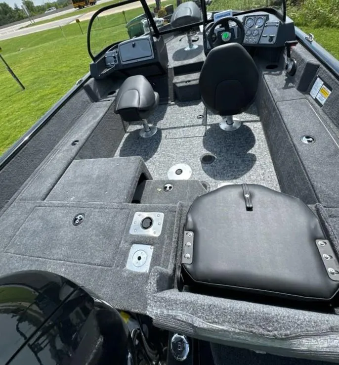 Slide: The Image of 2025 Tracker Pro Guide V-175 Combo boat interior with seating and controls. - 7
