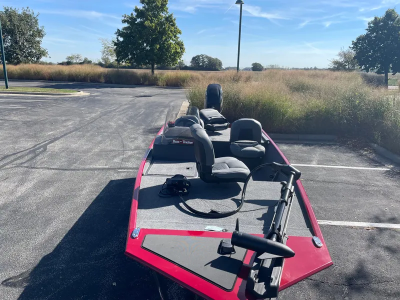 Slide: The Image of 2025 Tracker Bass Tracker Classic XL boat in parking lot, sunny day. - 4