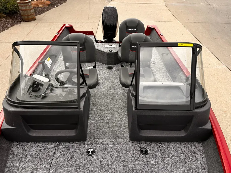 Slide: The Image of 2025 Tracker Pro Guide V-16 WT boat interior with dual consoles and seating. - 5