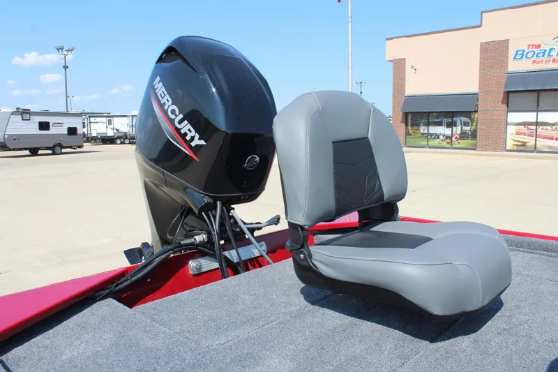 Slide: The Image of 2025 Tracker Bass Tracker Classic XL boat with Mercury engine and gray seat. - 16