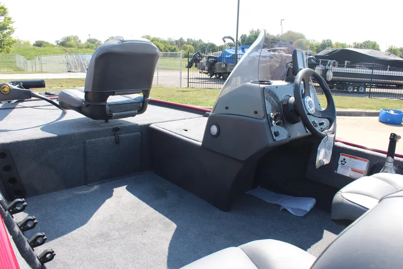 Slide: The Image of 2025 Tracker Bass Tracker Classic XL boat interior with steering console and seating. - 19