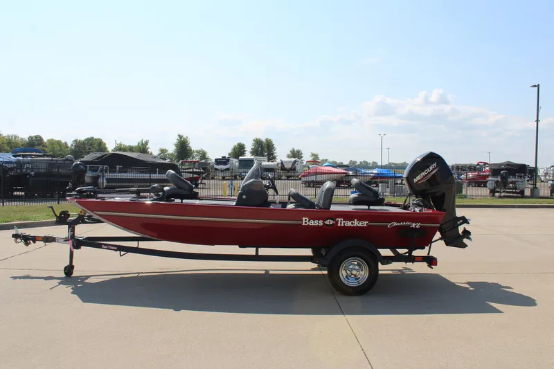 Slide: The Image of 2025 Tracker Bass Tracker Classic XL boat on trailer, parked outdoors. - 4