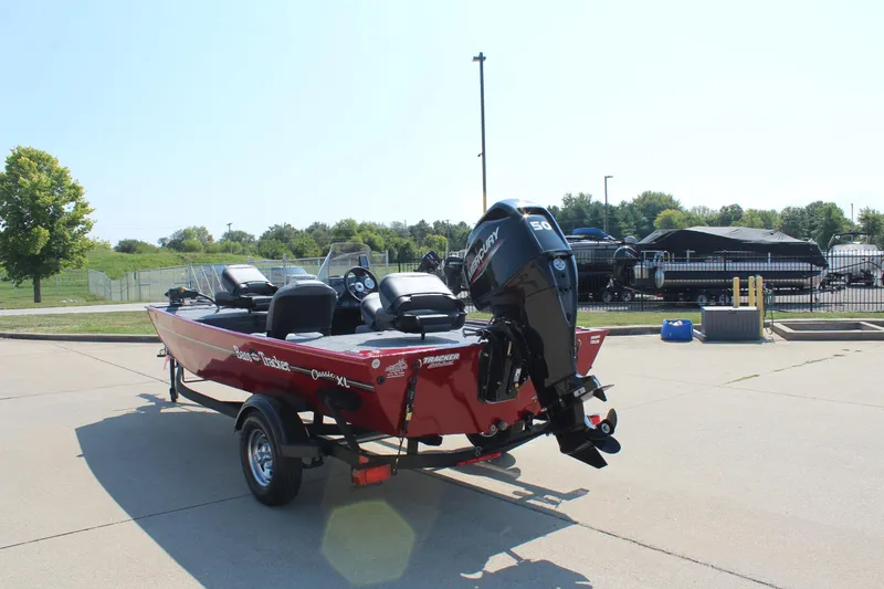 Slide: The Image of 2025 Tracker Bass Tracker Classic XL boat on trailer, parked outdoors. - 5