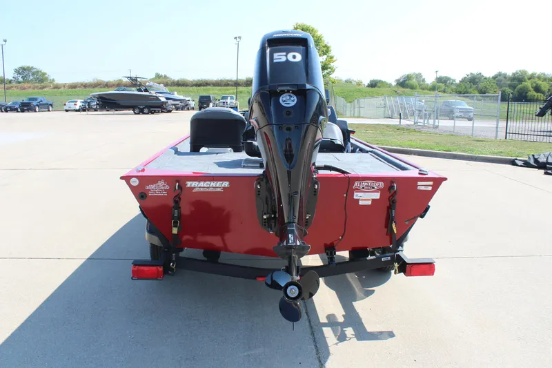 Slide: The Image of 2025 Tracker Bass Tracker Classic XL boat with 50 HP motor, parked outdoors. - 6