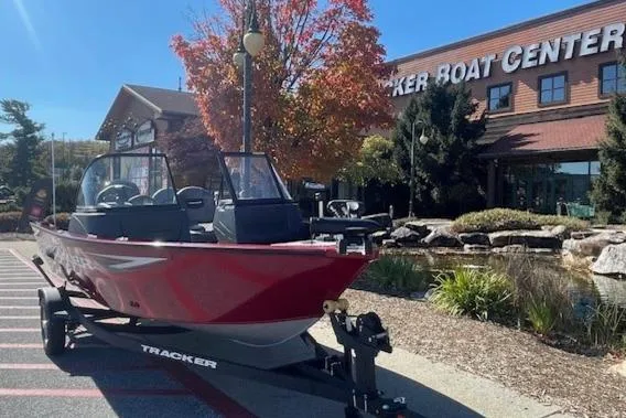 Slide: The Image of 2025 Tracker Pro Guide V-16 WT boat displayed at Tracker Boat Center. - 2
