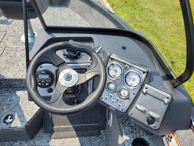 Slide: The Image of Dashboard of 2025 Tracker Pro Guide V-175 Combo boat with steering wheel and gauges. - 3