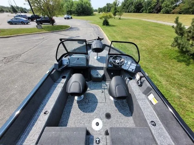 Slide: The Image of 2025 Tracker Pro Guide V-175 Combo boat interior with dual seats and control panel. - 5