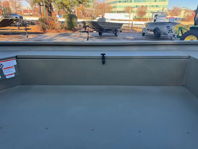 Slide: The Image of 2025 Tracker Grizzly 1654 T Sportsman boat interior with storage compartment. - 41