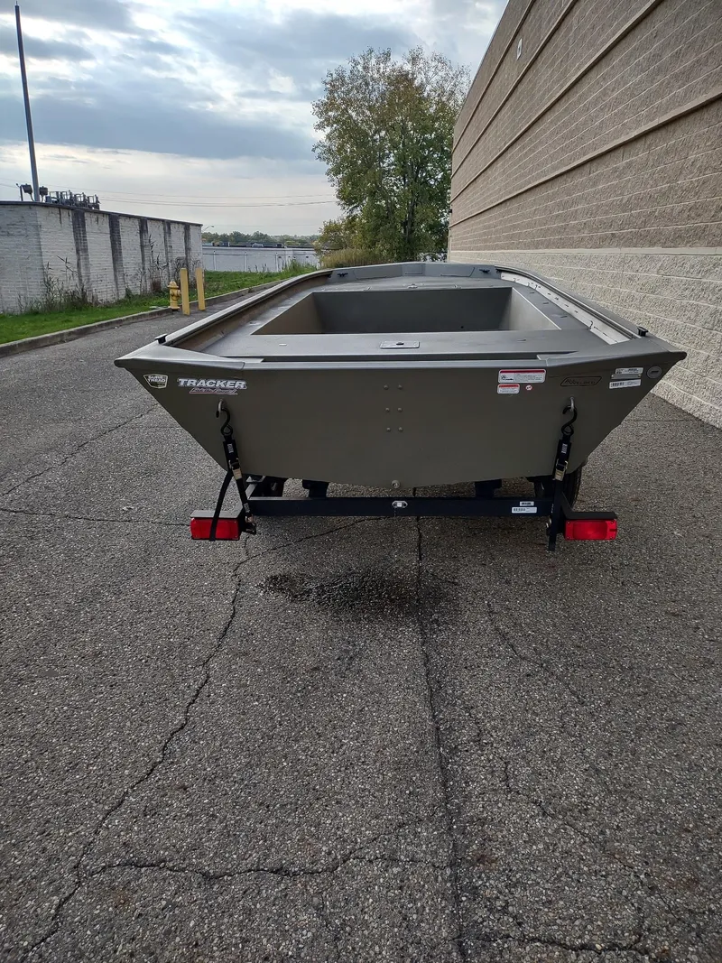 Slide: The Image of 2025 Tracker Grizzly 1754 Jon boat on trailer, parked outdoors. - 5