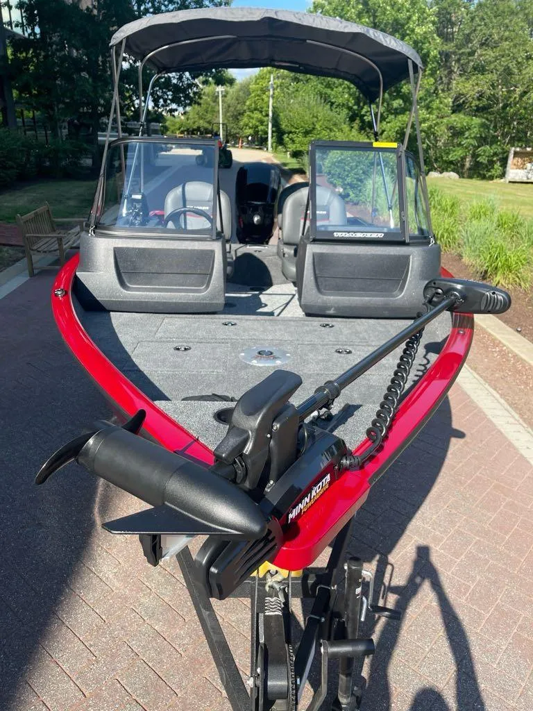 Slide: The Image of 2025 Tracker Pro Guide V-16 WT boat with canopy and trolling motor. - 2