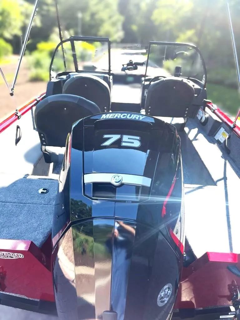 Slide: The Image of 2025 Tracker Pro Guide V-16 WT boat with Mercury 75 engine, rear view. - 3