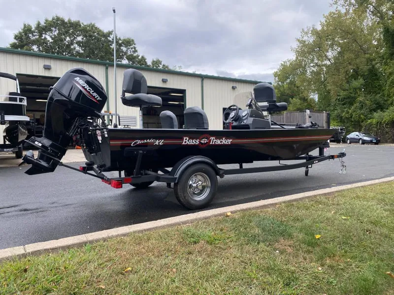 Slide: The Image of 2025 Tracker Bass Tracker Classic XL boat on trailer, parked outdoors. - 3