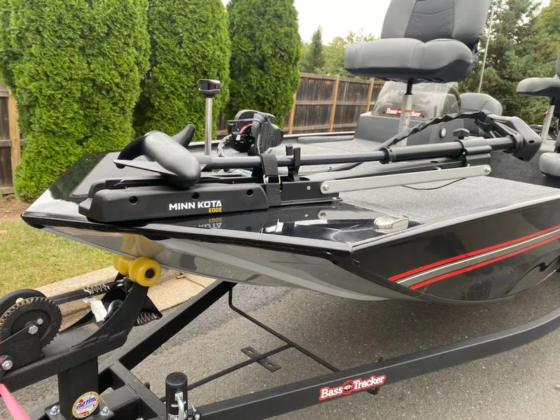 Slide: The Image of 2025 Tracker Bass Tracker Classic XL boat with Minn Kota motor on trailer. - 4