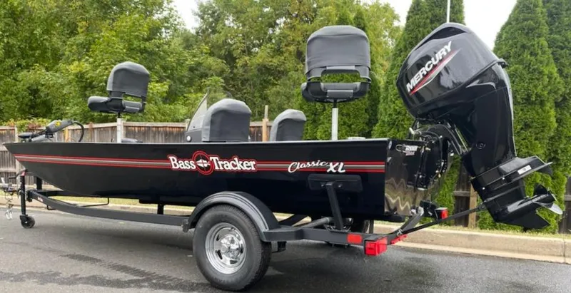 Slide: The Image of 2025 Tracker Bass Tracker Classic XL boat with Mercury engine on trailer. - 5