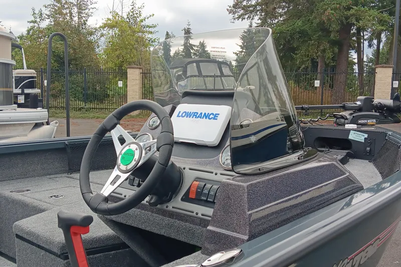 Slide: The Image of 2024 Ranger VS1782SC Angler boat with Lowrance electronics and steering wheel. - 2