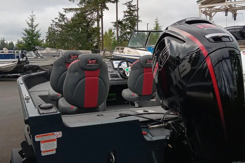 Slide: The Image of 2024 Ranger VS1782SC Angler boat with Mercury outboard motor, parked outdoors. - 3